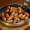 Chipolata Sausages cooked in frying pan